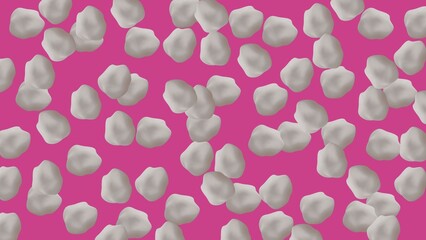 popcorn kernels on pink background 