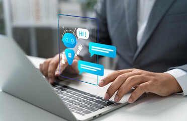 AI chatbot concept, Businessman using laptop with AI chatbot interface on screen, representing smart virtual assistant, customer support automation, digital communication in modern business services