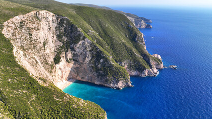 Aerial drone photo of not so famous paradise beach of Atsiganos with white steep rocks creating a blue lagoon in the Northern part of Zakinthos island only accessible by boat, Ionian Sea, Greece