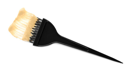 Brush with hair dyeing product isolated on white, top view