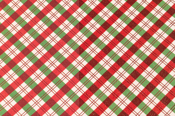 Festive red and green checkered plaid pattern with diagonal stripes