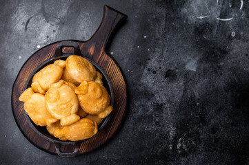 Korean winter snack Bungeoppang, Fish shaped Waffle with sweet filling. black background. top view