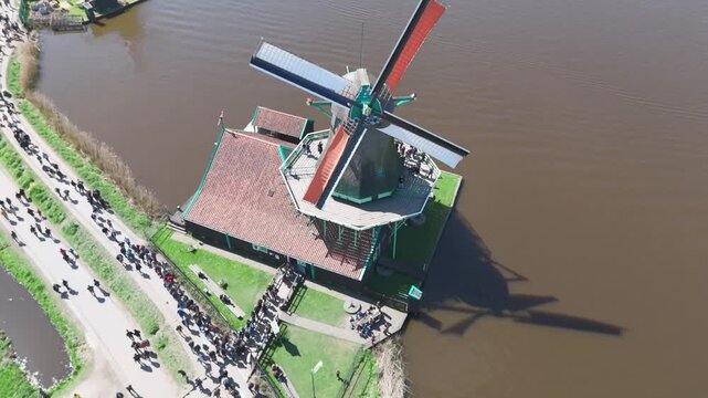 Aerial 4K Drone Footage of Zaanse Schans Windmills near Amsterdam, Netherlands &ndash; Scenic Dutch Village with Traditional Houses and River View