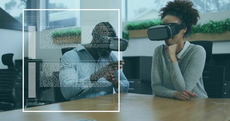 Interacting coworkers manipulating virtual content in office conference room, with VR headsets