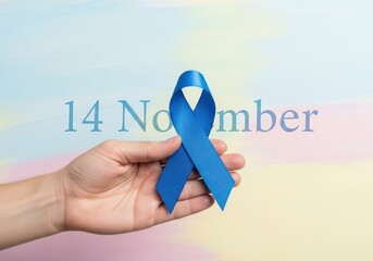 Hand holding blue ribbon on light background, november 14 world diabetes day