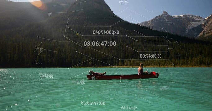 Floating couple in red canoe gliding on turquoise lake in pine valley, with overlays, life vest