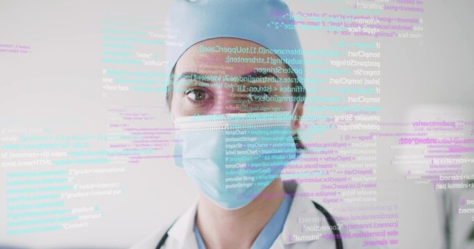 Female doctor analyzing floating code overlay in clinic, with stethoscope, medical mask, lab coat - Powered by Adobe