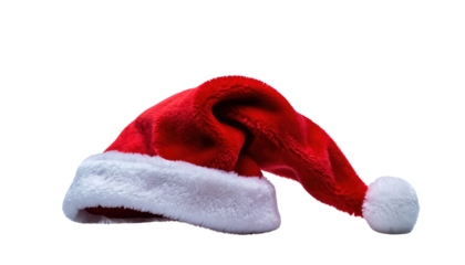 A single santa hat with a red body and white trim lying on a black background in a studio shot