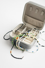 Beaded jewelry storage box filled with handmade necklaces.