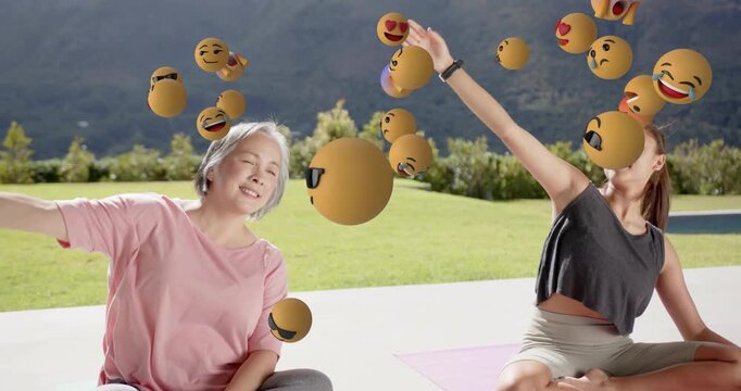 Woman and girl starting fitness side-stretch lifting arms syncing swirling emojis showing mood