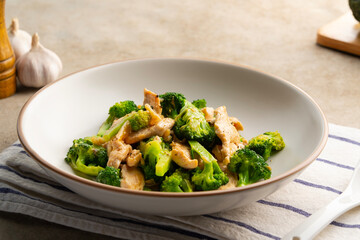 Stir Fried sliced Broccoli with chicken breast in oyster sauce.Thai food.