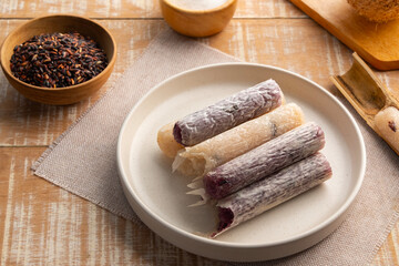 Khao Lam,glutinous rice roasted in bamboo.Baked Sticky Rice with coconut milk ,black bean and sugar in bamboo joints.Thai dessert.