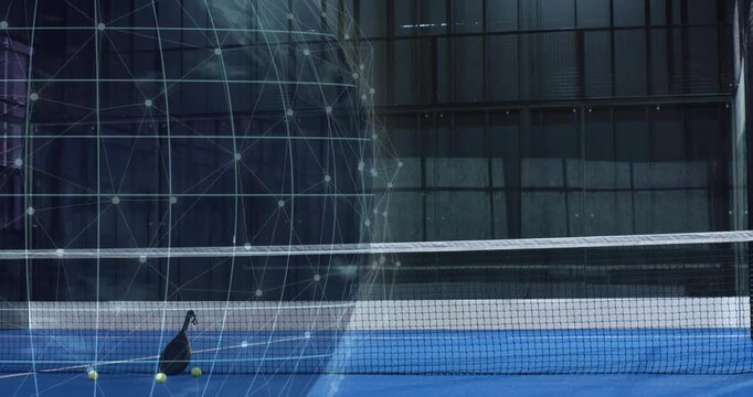 Holographic sphere appearing pulsing beside tennis racket on net with balls landing showing court