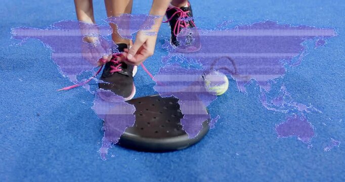 Female athlete stepping onto platform on blue tennis court, threading pink shoelaces for training