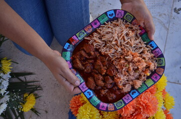 Authentic fiesta feast featuring delicious carne guisada, spaghetti, and rice, perfect for celebrating Dia de los Muertos with vibrant cultural flair