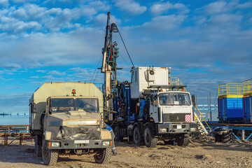 The Northern gas field. Summer. Installation for lowering a flexible pipe into a well. Equipment for testing and development of a gas well