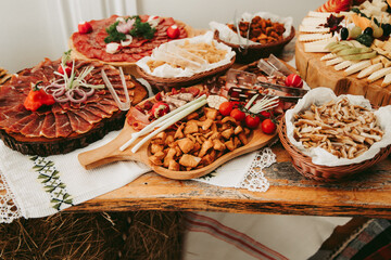 Luxury buffet in the restaurant. Variety of sausages and cheeses. Romanian traditional style.