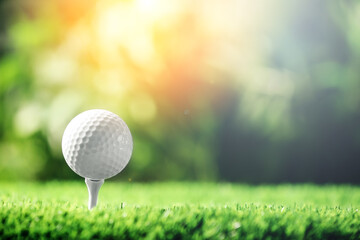 Golf ball with tee on grass outdoors, space for text