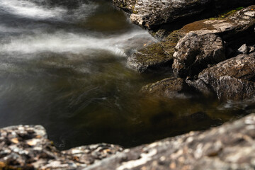Water spirit in motion, river Indalsälven flowing over rocks in Sweden