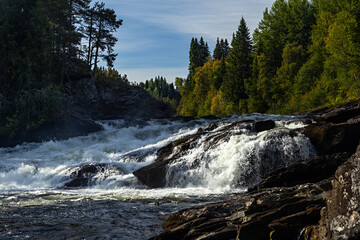 White water rapids flowing on the Indalsälven river near Ristafallet waterfall in Sweden