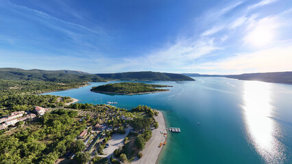 Lake Lac de Sainte-Croix with small island Ile de Costebelle, Alpes-de-Haute-Provence, France, Europe.