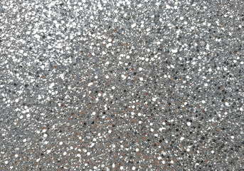 Fototapeta premium Silver glitter texture creating a sparkling and festive background, ideal for celebrations, holidays, and design projects