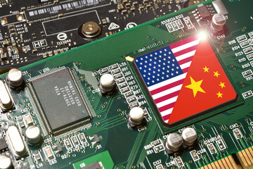 Flag of the United States and Republic of China on microchip of a PC Motherboard. Concept for world supremacy in microchip and semiconductor manufacturing.
