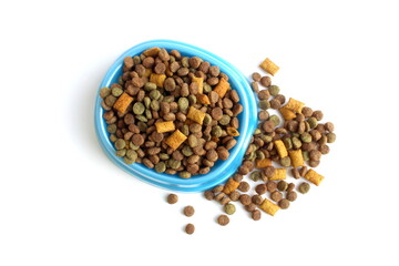 There is a bowl of dry pet food on a white background.