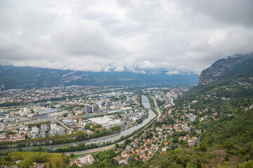 Aerial view of Grenoble seen from Bastille Fort, Auvergne-Rhone-Alpes region, France, Europe. View from above on the Isere Valley in the French Pre-Alps. Chartreuse Belledonne mountain range