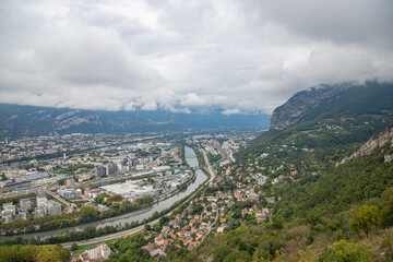 Aerial view of Grenoble seen from Bastille Fort, Auvergne-Rhone-Alpes region, France, Europe. View from above on the Isere Valley in the French Pre-Alps. Chartreuse Belledonne mountain range