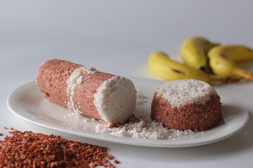 Navara rice puttu, cylindrical and dome shaped steamed rice cake with Navara rice grains
