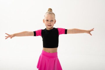 Young dancer with cochlear implant extending arms gracefully. Expression of inclusion, sound...