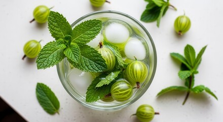 Refreshing Homemade Drink With Gooseberries, Mint, And Ice in a Glass High Angle.