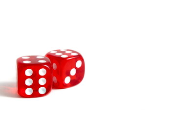 There are red dice lying on a white background.