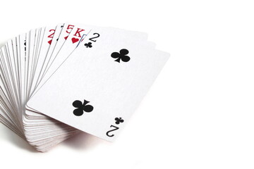 A deck of playing cards lies on a white background.	