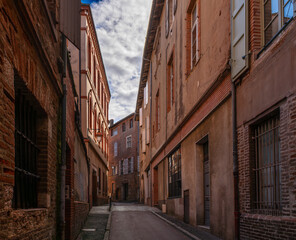 A typical old street in the city of Albi, in the Tarn department, in Occitanie, France.