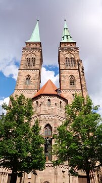 Saint Sebald Church on Sunny Day. Green Trees. Nuremberg, Franconia, Germany. Vertical Video