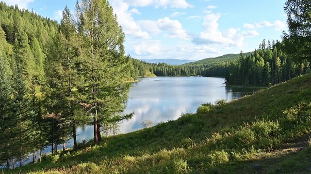 Magnificent landscape of Lake Uchkel on a beautiful sunny day in Altai Republic, Russia
