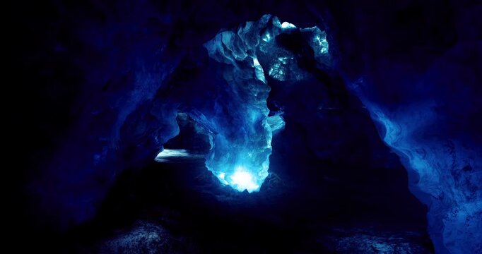 Visitors wander through a stunning ice cave, awash in vibrant blue light. The icy formations and reflective surfaces create a magical atmosphere, drawing adventurers to this enchanting destination.