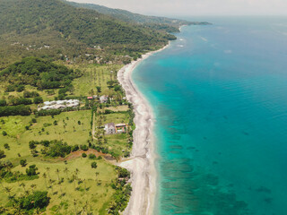 The coastal view is surrounded by enchanting green hills, including Merese Hill, which offers a spectacular viewpoint to enjoy the scenery. LOMBOK, NTB , INDONESIA