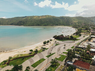The coastal view is surrounded by enchanting green hills, including Merese Hill, which offers a spectacular viewpoint to enjoy the scenery. LOMBOK, NTB , INDONESIA