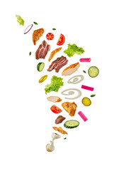 Assortment of fresh food ingredients and cooked meats flying in a dynamic cascade isolated on transparent background