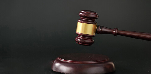 Wooden Judges Gavel on Black Surface