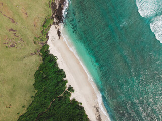 The coastal view is surrounded by enchanting green hills, including Merese Hill, which offers a spectacular viewpoint to enjoy the scenery. LOMBOK, NTB , INDONESIA