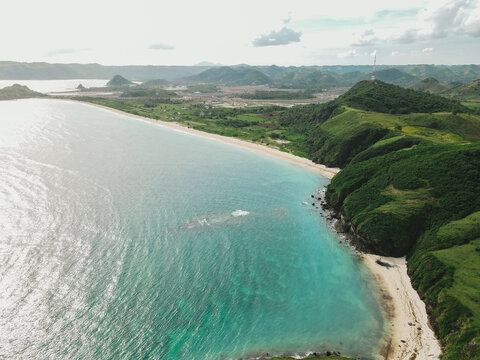 The coastal view is surrounded by enchanting green hills, including Merese Hill, which offers a spectacular viewpoint to enjoy the scenery. LOMBOK, NTB , INDONESIA