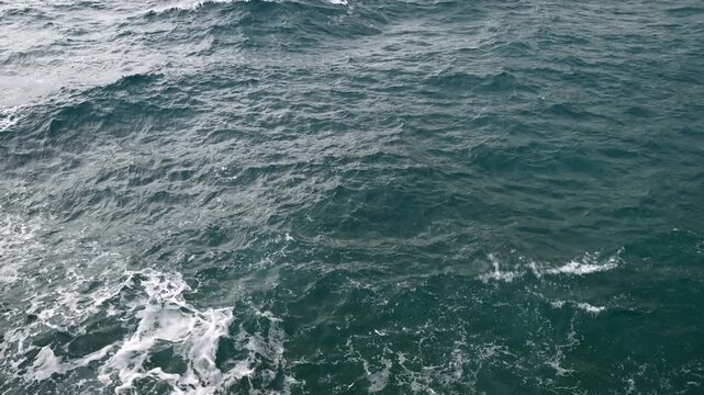 Majestic ocean waves in motion captured in cloudy day