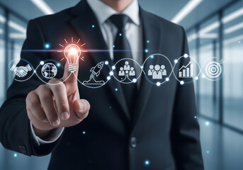 Businessman touching digital icons representing business growth and innovation