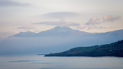 On a peaceful, Eyjafjörður Fjord sailing into Akureyri, misty start to a beautiful day, August 2025 