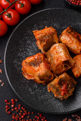Hake fish cooked in pieces in tomato sauce, stew with peppers and carrots. Hake fish in tomato