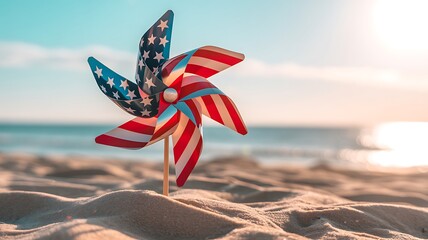 A vibrant american flag pinwheel rests in the sand on a beach, with the gentle waves and sunny sky evoking a sense of national pride
